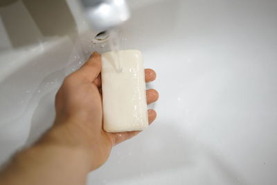 Close-up of hand holding ice cream