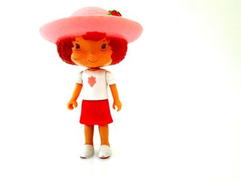 Close-up of toy figurine against white background