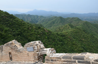 Old ruins on mountain against sky