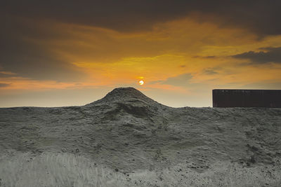 Scenic view of dramatic sky during sunset