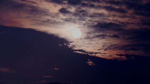 Low angle view of moon in sky at night