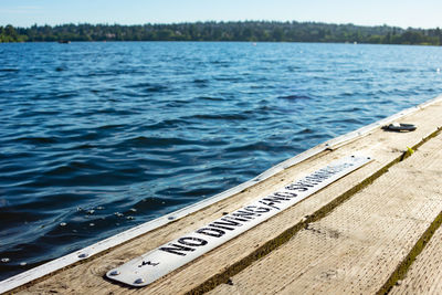 Text on pier over lake