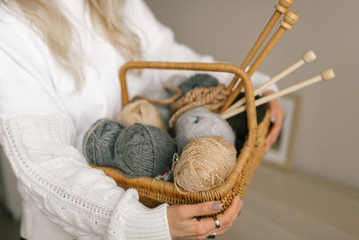 Close-up of woman hand holding basket