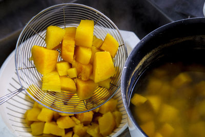 High angle view of orange in container on table