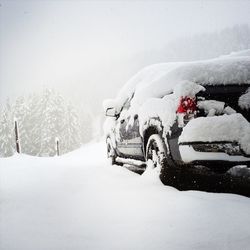 Car on field during snowfall