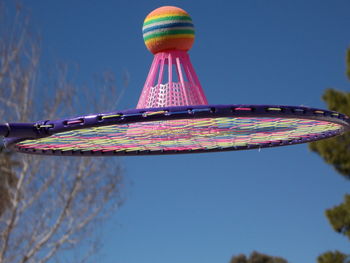 Low angle view of multi colored lights against clear sky