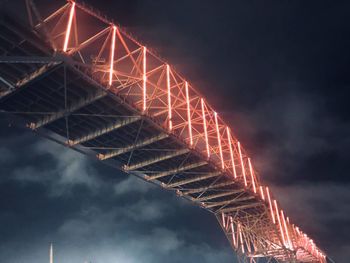Low angle view of illuminated bridge against sky