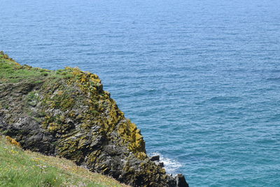 High angle view of rocks by sea