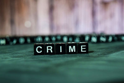 Close-up of information sign on table