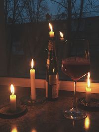 Close-up of illuminated tea light candles at night