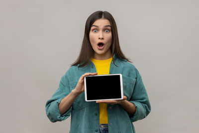 Young woman using digital tablet