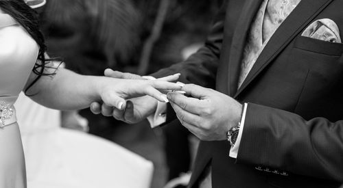 Close-up of couple holding hands