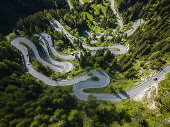 Aerial image of cars on maloja mountain pass road, engadin, switzerland