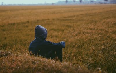 Man sitting on field