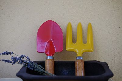 Close-up of equipment on table against wall at home