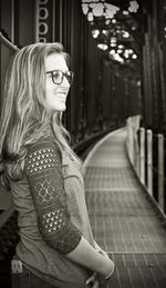 Portrait of smiling young woman standing outdoors