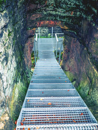 High angle view of footbridge amidst mountains