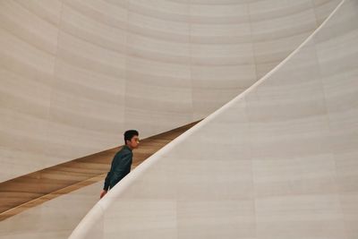 Full length of man with umbrella