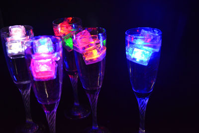 Close-up of wine glass against black background