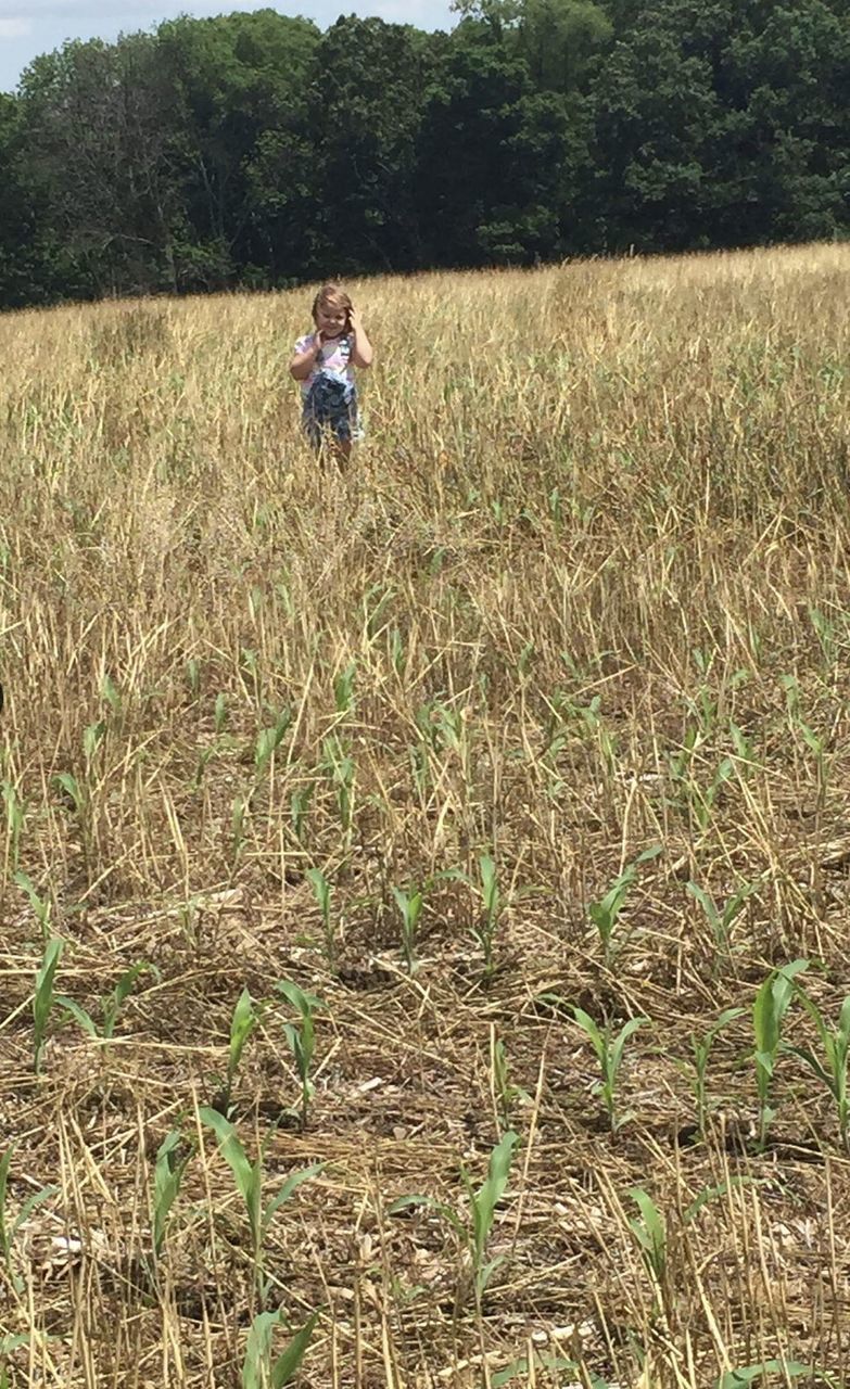 FULL LENGTH OF WOMAN STANDING ON FARM