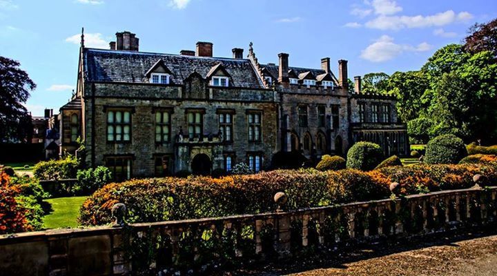 architecture, built structure, building exterior, sky, tree, history, railing, cloud - sky, famous place, travel destinations, arch, day, sunlight, the past, plant, fence, outdoors, low angle view, old, stone wall