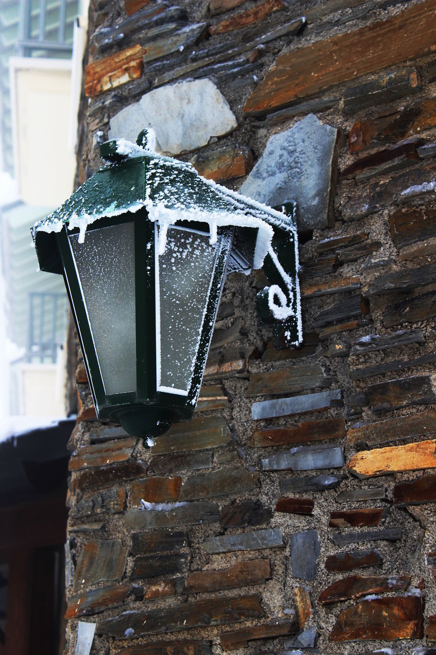 CLOSE-UP OF OLD WALL WITH ICE