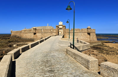 View of fort against clear blue sky