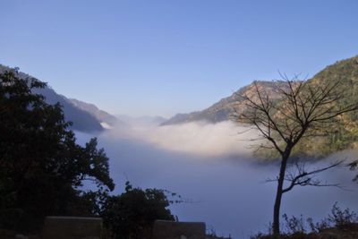 Scenic view of mountains against clear blue sky