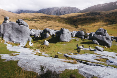 Scenic view of rocks on land against sky