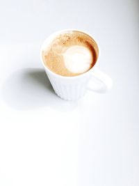 High angle view of coffee cup on table
