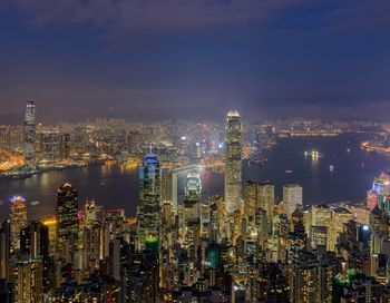 High angle view of city lit up at night