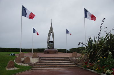 Flag on built structure against sky