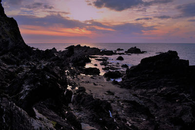 Scenic view of sea against sky during sunset