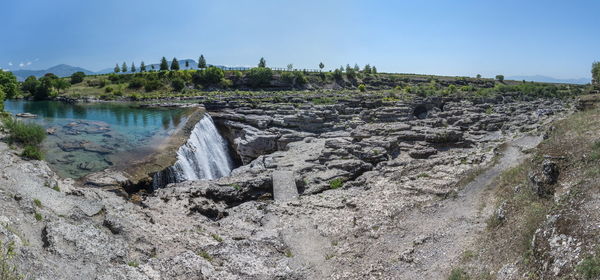 Panoramic view of land against clear sky