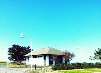 Low angle view of built structure against clear blue sky