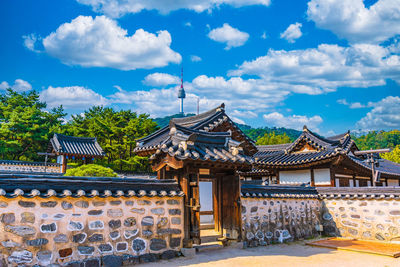 View of temple building against cloudy sky