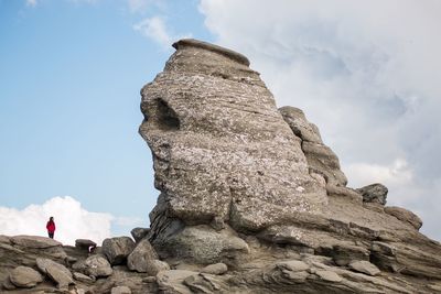 Low angle view of rock formation on cliff