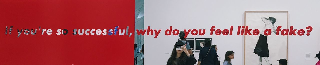 Red text hanging on wall