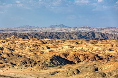 Scenic view of landscape and mountains against sky