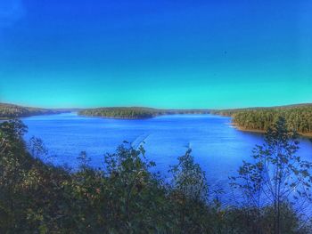 Scenic view of sea against clear blue sky