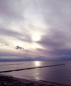 Scenic view of sea against cloudy sky