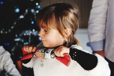 Close-up of girl holding apple