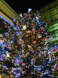 Low angle view of illuminated lights at night