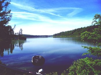 Scenic view of lake against cloudy sky