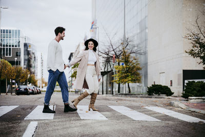 People standing on sidewalk in city