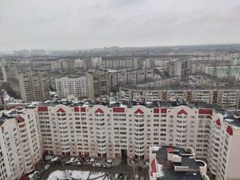 High angle view of buildings in city against sky