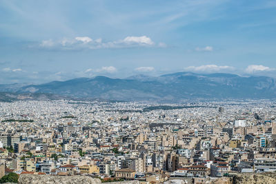 High angle view of city against cloudy sky