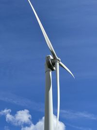 Low angle view of windmill against sky