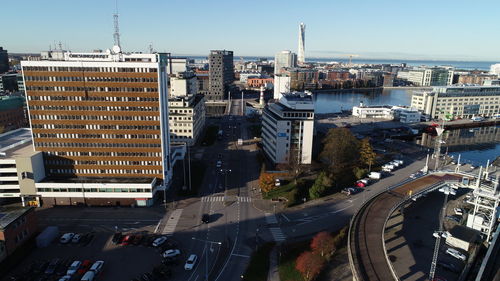 High angle view of street amidst buildings against sky