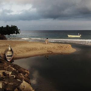 Scenic view of beach against sky